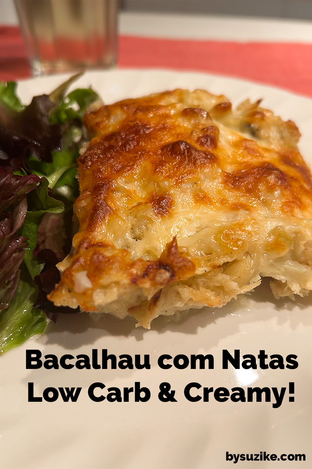Golden slice of low carb Bacalhau com Natas served with green salad