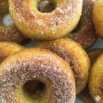 Close up of keto cinnamon donuts coated with cinnamon sweetener thumbnail