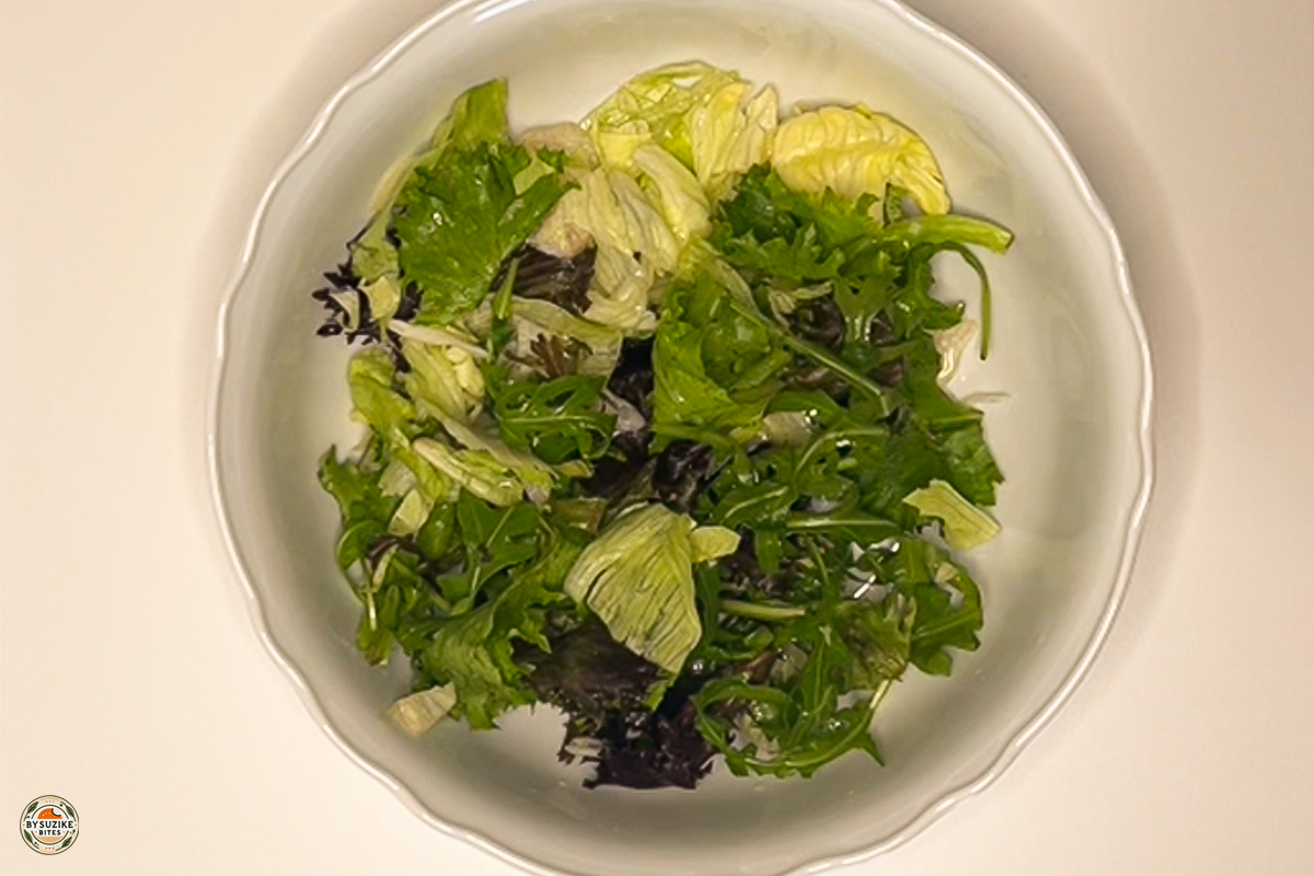 Chopped romaine lettuce in a mixing bowl, ready for toppings
