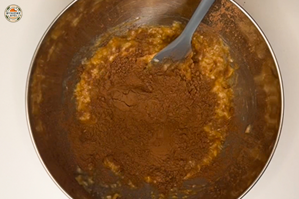 Mixing cocoa powder into the banana and peanut butter mixture