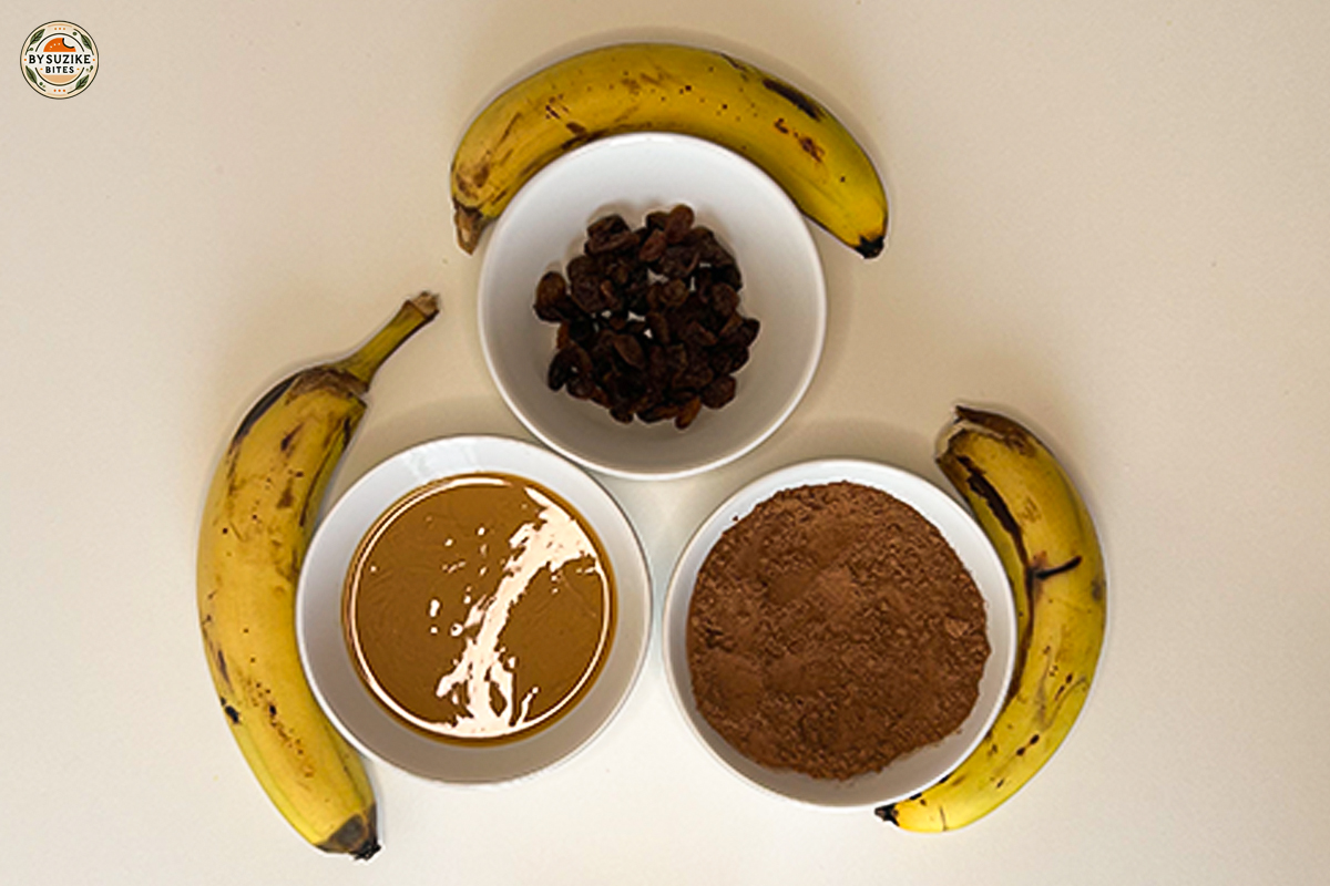Ingredients for healthy vegan banana brownies – bananas, raisins, cocoa powder, peanut butter