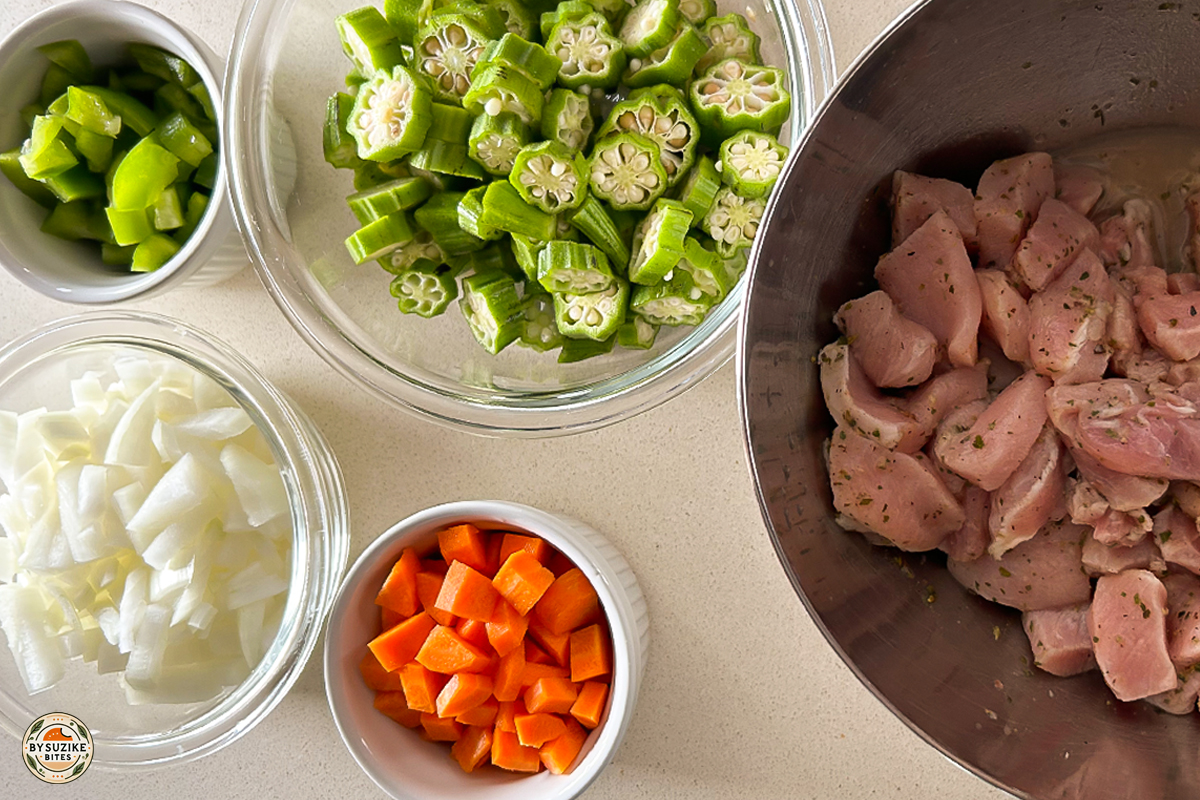 pork-with-okra-ingredients-prep-bysuzikebites Ingredients prepped for pork with okra recipe including pork, okra, onions, carrots and bell pepper