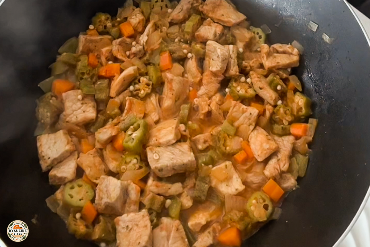 pork-with-okra-step-11-simmering Step 11: Pork and okra stew simmering until tender