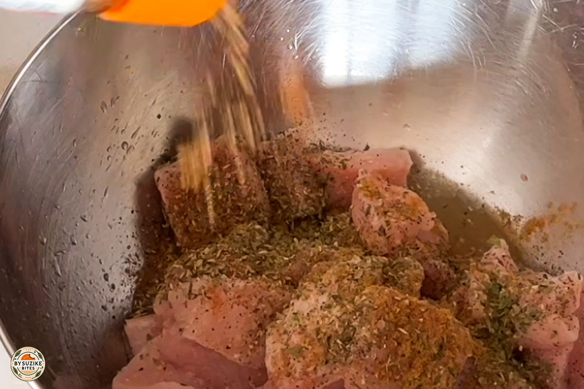 pork-with-okra-step-4-mixing-seasonings Step 4: Mixing spices into the pork to season it evenly