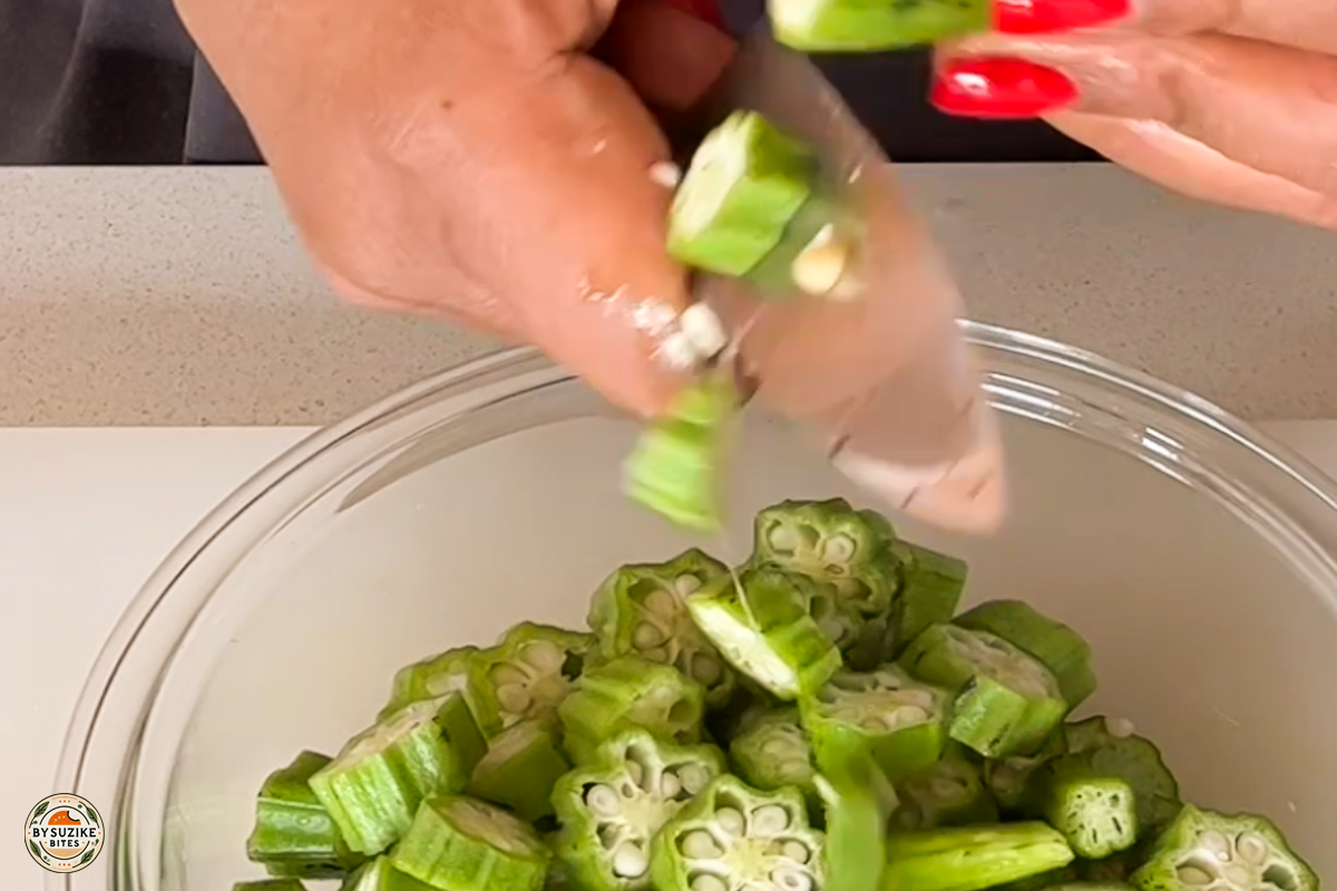 pork-with-okra-step-5-chopping-okra Step 5: Chopping fresh okra into slices for the stew