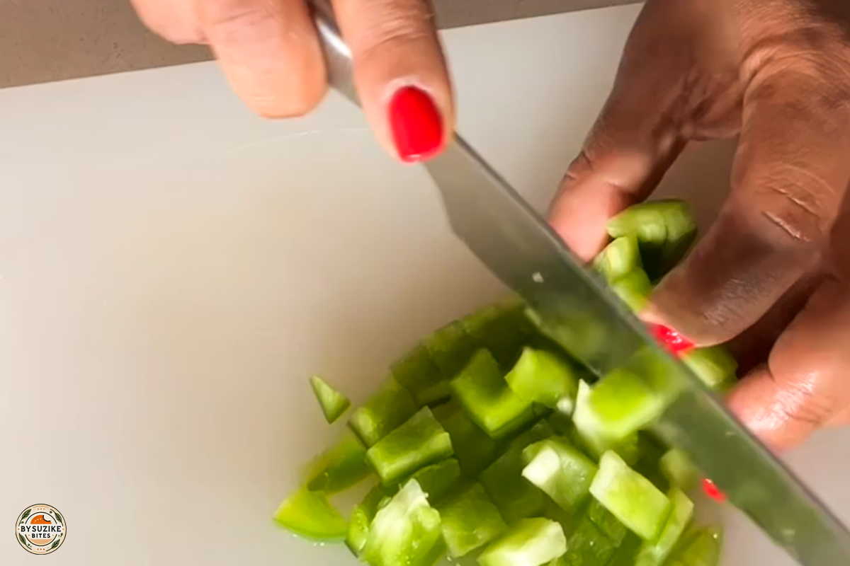 pork-with-okra-step-7-chopping-green-pepper Step 7: Chopping green bell pepper for the recipe