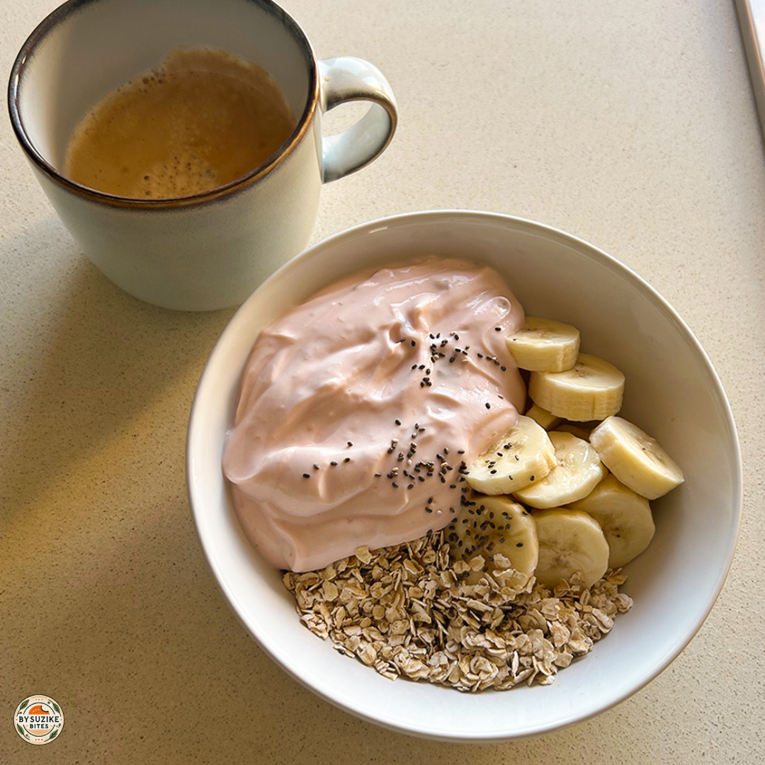 Yogurt oats bowl with banana and chia seeds, served with black coffee